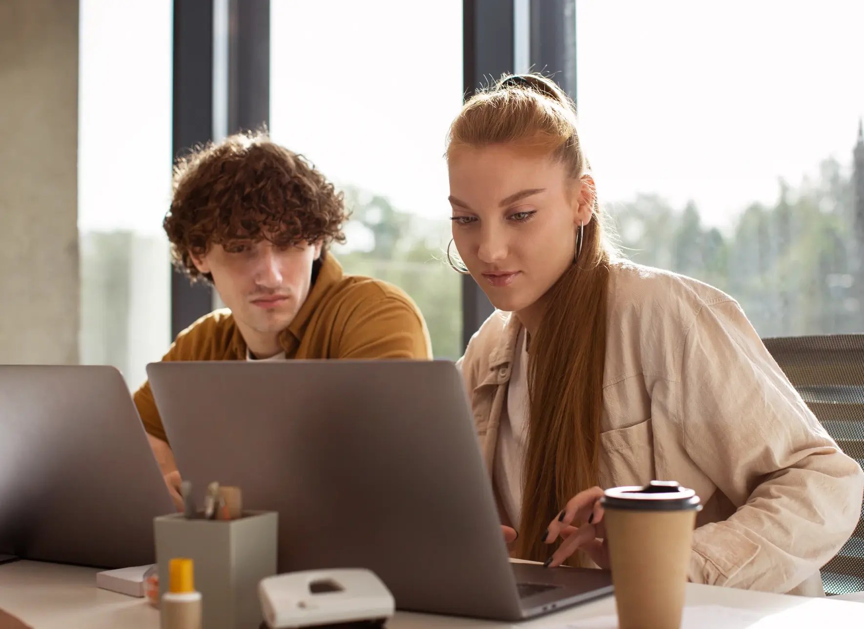 medium_shot_people_working_laptops_1